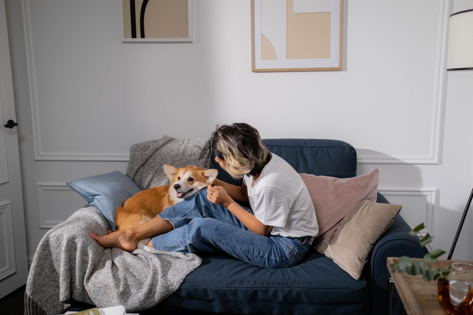 Relaxing at home on the couch with a dog after a clean